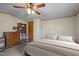 Comfortable bedroom featuring a ceiling fan and storage space with a neutral color scheme at 1823 E Geer St, Durham, NC 27704
