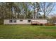 Charming mobile home with a front yard and deck at 1823 E Geer St, Durham, NC 27704