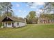 Wide view of several buildings on the property. Set on a large, grassy lot at 1823 E Geer St, Durham, NC 27704