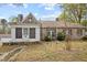 Angle view of stone home featuring two attached structures and a grassy yard at 1823 E Geer St, Durham, NC 27704