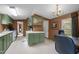 Spacious kitchen features classic green cabinets, white countertops, and ample counter space at 1823 E Geer St, Durham, NC 27704