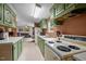 Functional kitchen with green cabinets, white countertops, and standard appliances at 1823 E Geer St, Durham, NC 27704