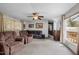 Inviting living room with plush seating, ceiling fan, and natural light at 1823 E Geer St, Durham, NC 27704