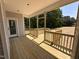 New wooden back porch with railings overlooking trees at 192 Royal Ave, Selma, NC 27576