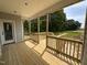Inviting, new wooden back porch with railing, perfect for relaxing outdoors at 192 Royal Ave, Selma, NC 27576