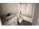 Modern bathroom features granite-look vanity, new toilet, and shower with white surround at 192 Royal Ave, Selma, NC 27576
