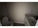 Another bathroom view featuring granite-look vanity and new toilet, ready for your personal touches at 192 Royal Ave, Selma, NC 27576