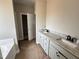 Stylish bathroom featuring double vanity with granite countertops at 192 Royal Ave, Selma, NC 27576