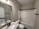 Simple bathroom with granite vanity and shower and tub combination at 192 Royal Ave, Selma, NC 27576