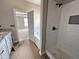 Elegant bathroom with a luxurious bathtub and a separate tile shower, perfect for relaxation at 192 Royal Ave, Selma, NC 27576