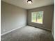 Cozy bedroom with neutral walls, carpet flooring and natural lighting at 192 Royal Ave, Selma, NC 27576
