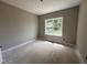 Bright bedroom with a large window offering a view of the outside, awaiting your personal touch at 192 Royal Ave, Selma, NC 27576