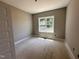 Cozy bedroom with neutral walls and a bright window at 192 Royal Ave, Selma, NC 27576