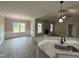 Beautiful kitchen featuring stone countertops, stainless faucet, and view to living room at 192 Royal Ave, Selma, NC 27576