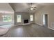 Spacious living room with fireplace, high ceilings and light wood flooring at 192 Royal Ave, Selma, NC 27576
