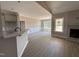 Open-concept living room with breakfast bar, chair railing, and bright natural light at 192 Royal Ave, Selma, NC 27576