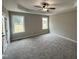 Bright main bedroom with tray ceiling and large windows at 192 Royal Ave, Selma, NC 27576