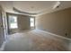 Large bedroom with tray ceiling and two windows at 192 Royal Ave, Selma, NC 27576