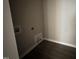 Unfinished utility room with dark wood flooring at 192 Royal Ave, Selma, NC 27576