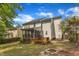 Home's backyard features a patio, fire pit, and leads to the screened porch at 2002 Patapsco Dr, Apex, NC 27523