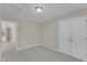 Neutral bedroom showcasing carpet floors, a ceiling light, and double-door closet at 2002 Patapsco Dr, Apex, NC 27523
