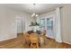 A brightly lit breakfast nook has views of the backyard from the glass patio doors at 2002 Patapsco Dr, Apex, NC 27523