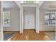 Bright foyer features hardwood floors and ample natural light from nearby windows at 2002 Patapsco Dr, Apex, NC 27523
