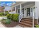 Inviting front porch with brick steps and manicured shrubbery at entrance at 2002 Patapsco Dr, Apex, NC 27523