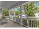 Cozy covered porch showcasing white railing and a peaceful neighborhood view at 2002 Patapsco Dr, Apex, NC 27523