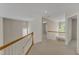 Open hallway with view of chandelier at 2002 Patapsco Dr, Apex, NC 27523