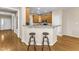 Granite countertops line the breakfast bar in this kitchen, perfect for morning meals at 2002 Patapsco Dr, Apex, NC 27523