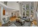 Open living room shows access to the dining room and kitchen with a bar for seating at 2002 Patapsco Dr, Apex, NC 27523