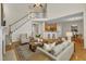 An open living room shows access to the second story, kitchen, and dining room at 2002 Patapsco Dr, Apex, NC 27523