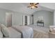 Comfortable main bedroom featuring vaulted ceilings, an ensuite bathroom, and a walk-in closet at 2002 Patapsco Dr, Apex, NC 27523