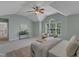 Bright main bedroom with vaulted ceilings, fan, and large window allowing for plenty of natural light at 2002 Patapsco Dr, Apex, NC 27523