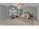 Spacious main bedroom with vaulted ceiling, large window, sitting area, and neutral carpet at 2002 Patapsco Dr, Apex, NC 27523