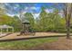Community recreational area including playground equipment and swings for outdoor fun and leisure at 2002 Patapsco Dr, Apex, NC 27523