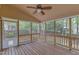 Large screened porch with wood flooring and ceiling fan for enjoying the outdoors at 2002 Patapsco Dr, Apex, NC 27523