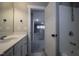 Updated bathroom features a vanity with a large mirror and a shower with chrome fixtures at 2012 Longmont Dr, Wake Forest, NC 27587