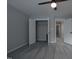 Bedroom showcasing carpeting and a large closet for storage with bright and modern fixtures at 2012 Longmont Dr, Wake Forest, NC 27587