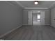 Neutral colored bedroom with carpet, white trim, and multiple doorways at 2012 Longmont Dr, Wake Forest, NC 27587