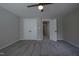 Bedroom featuring a ceiling fan, soft carpeting, and a large closet with white doors at 2012 Longmont Dr, Wake Forest, NC 27587