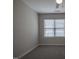 Bedroom featuring carpeting and a large window providing lots of light with white blinds at 2012 Longmont Dr, Wake Forest, NC 27587