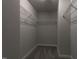 Walk-in closet with wire shelving and neutral carpet at 2012 Longmont Dr, Wake Forest, NC 27587