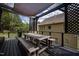Cozy deck area features picnic table and views of the backyard and wooded scenery at 2012 Longmont Dr, Wake Forest, NC 27587