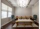 Bright dining area with a wooden table, bench, blue chairs, and modern chandelier at 2012 Longmont Dr, Wake Forest, NC 27587