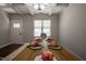 Stylish dining room featuring a large wooden table, coffered ceiling, and ample natural light at 2012 Longmont Dr, Wake Forest, NC 27587