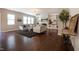 Spacious living room with hardwood floors, built-in shelves, fireplace, and comfortable seating at 2012 Longmont Dr, Wake Forest, NC 27587
