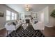 Inviting living room with a fireplace, built-in shelves, and lots of natural light from the windows at 2012 Longmont Dr, Wake Forest, NC 27587