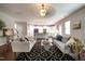 Open-concept living room with sofas and a kitchen island in the background at 2012 Longmont Dr, Wake Forest, NC 27587